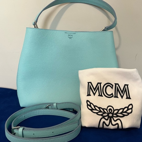 Authentic MCM two way purse in ocean blue color with dust bag.